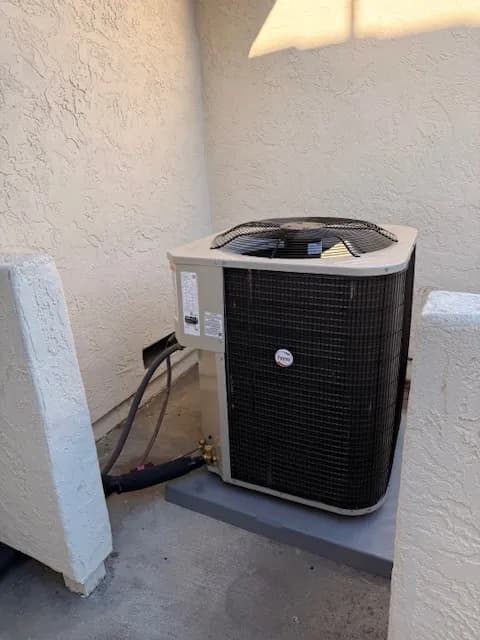 New energy-efficient outdoor AC condenser after professional installation